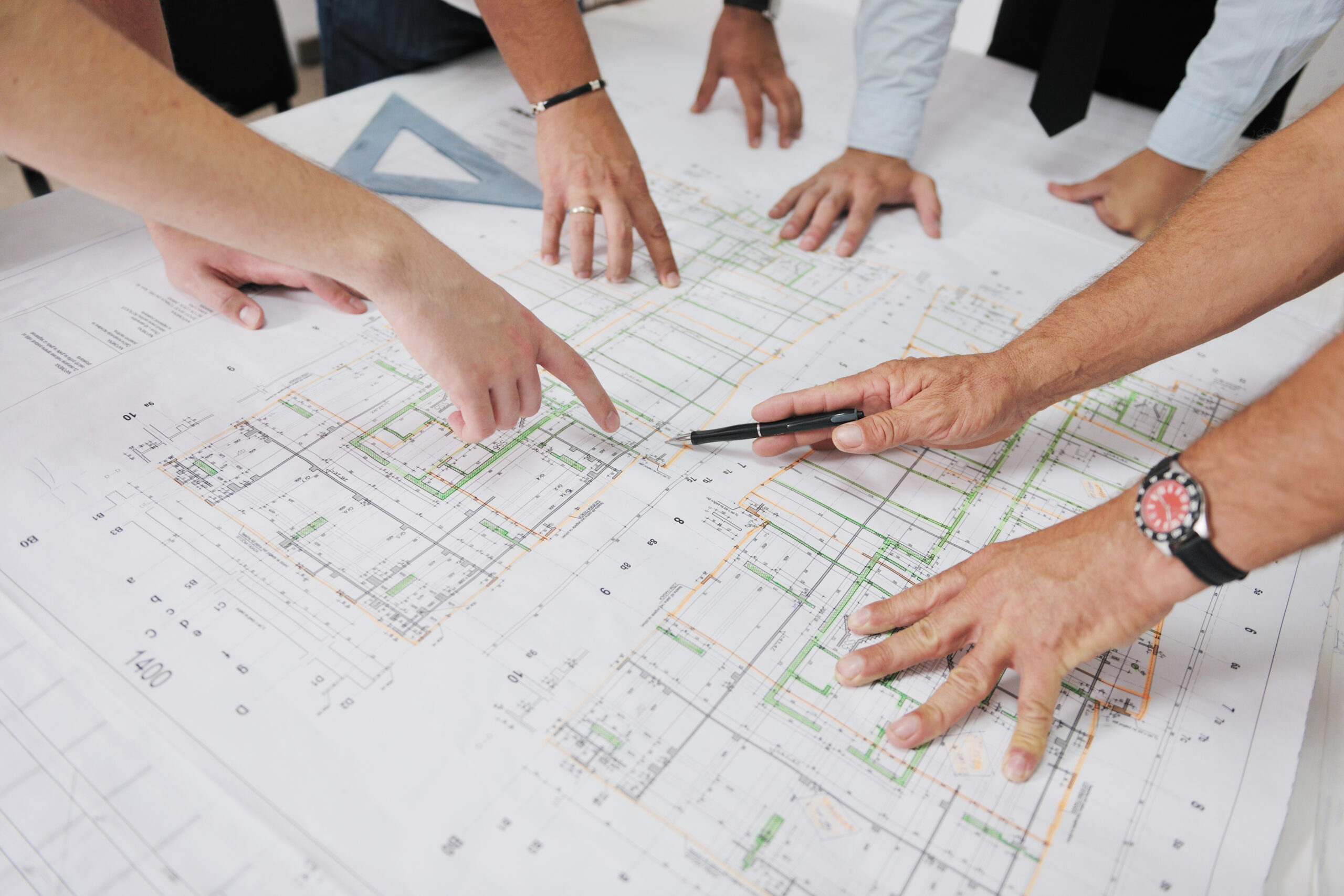 Team of architects on construciton site Team of architects people in group on construciton site check documents and business workflow